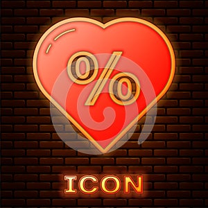 Glowing neon Discount percent tag in heart icon isolated on brick wall background. Shopping tag sign. Special offer sign