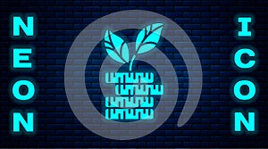 Glowing neon Dollar plant icon isolated on brick wall background. Business investment growth concept. Money savings and