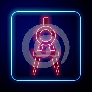 Glowing neon Drawing compass icon isolated on blue background. Compasses sign. Drawing and educational tools. Geometric
