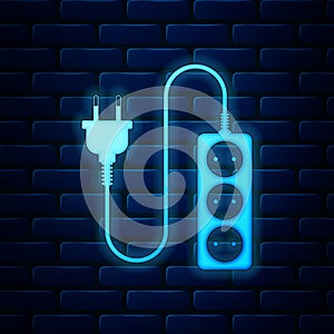 Glowing neon Electric extension cord icon isolated on brick wall background. Power plug socket. Vector