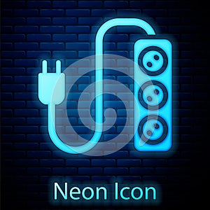 Glowing neon Electric extension cord icon isolated on brick wall background. Power plug socket. Vector
