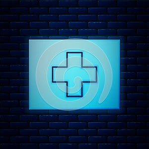 Glowing neon First aid kit icon isolated on brick wall background. Medical box with cross. Medical equipment for