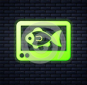 Glowing neon Fish finder echo sounder icon isolated on brick wall background. Electronic equipment for fishing. Vector