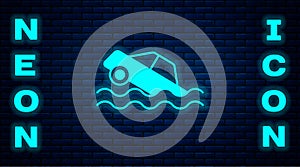 Glowing neon Flood car icon isolated on brick wall background. Insurance concept. Flood disaster concept. Security