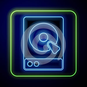 Glowing neon Hard disk drive HDD icon isolated on blue background. Vector