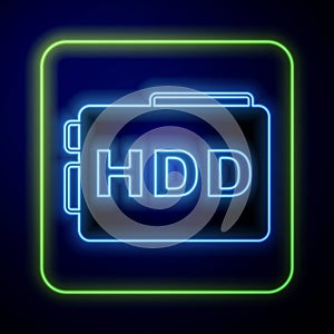 Glowing neon Hard disk drive HDD icon isolated on blue background. Vector