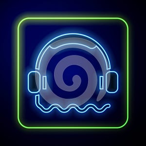 Glowing neon Headphones icon isolated on blue background. Support customer service, hotline, call center, faq