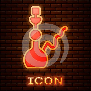 Glowing neon Hookah icon isolated on brick wall background. Vector