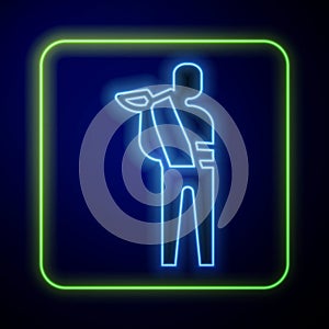 Glowing neon Human broken arm icon isolated on blue background. Injured man in bandage. Vector
