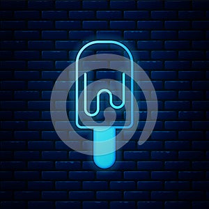 Glowing neon Ice cream on stick icon isolated on brick wall background. Sweet symbol. Vector