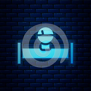 Glowing neon Industry metallic pipe and manometer icon isolated on brick wall background. Vector