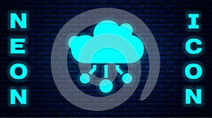 Glowing neon Internet of things icon isolated on brick wall background. Cloud computing design concept. Digital network