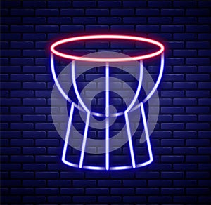 Glowing neon line African darbuka drum icon isolated on brick wall background. Musical instrument. Colorful outline