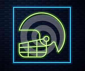 Glowing neon line American football helmet icon isolated on brick wall background. Vector