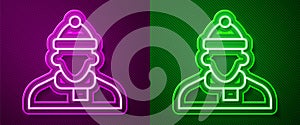 Glowing neon line Autumn clothes icon isolated on purple and green background. Vector