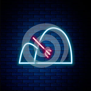 Glowing neon line Bale of hay and rake icon isolated on brick wall background. Colorful outline concept. Vector