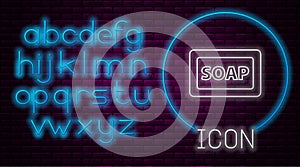 Glowing neon line Bar of soap icon isolated on brick wall background. Soap bar with bubbles. Neon light alphabet. Vector