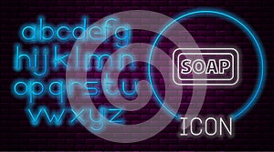 Glowing neon line Bar of soap icon isolated on brick wall background. Soap bar with bubbles. Neon light alphabet. Vector