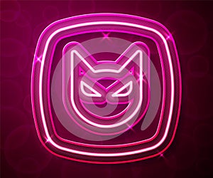 Glowing neon line Black cat icon isolated on red background. Happy Halloween party. Vector