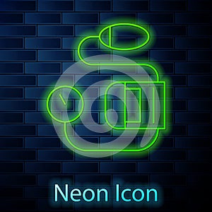 Glowing neon line Blood pressure icon isolated on brick wall background. Vector Illustration
