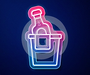 Glowing neon line Bottle of champagne in an ice bucket icon isolated on blue background. Vector