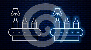 Glowing neon line Brewery factory production line pouring alcoholic drink in glass bottles icon isolated on brick wall