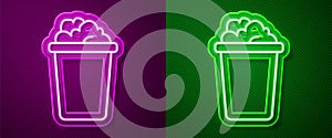 Glowing neon line Bucket with soap suds icon isolated on purple and green background. Bowl with water. Washing clothes