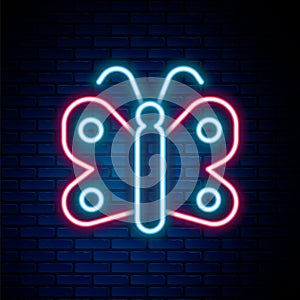 Glowing neon line Butterfly icon isolated on brick wall background. Colorful outline concept. Vector