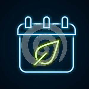 Glowing neon line Calendar with autumn leaves icon isolated on black background. Colorful outline concept. Vector