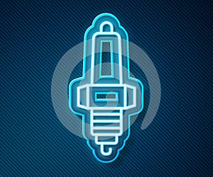 Glowing neon line Car spark plug icon isolated on blue background. Car electric candle. Vector