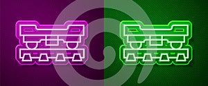 Glowing neon line Cargo train wagon icon isolated on purple and green background. Freight car. Railroad transportation
