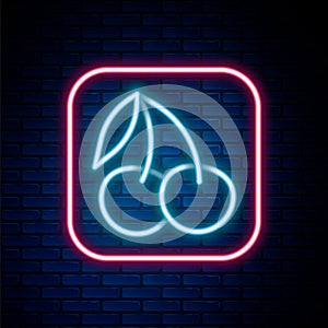 Glowing neon line Casino slot machine with cherry symbol icon isolated on brick wall background. Gambling games