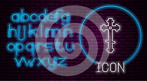 Glowing neon line Christian cross icon isolated on brick wall background. Church cross. Neon light alphabet. Vector