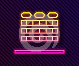 Glowing neon line Cinema auditorium with screen and seats icon isolated on black background. Vector Illustration