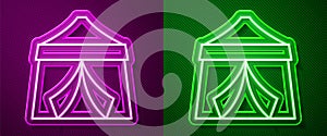 Glowing neon line Circus tent icon isolated on purple and green background. Carnival camping tent. Amusement park