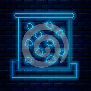 Glowing neon line Climbing wall icon isolated on brick wall background. Vector