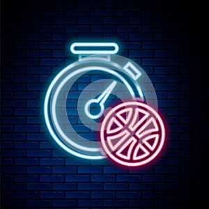 Glowing neon line Clock with basketball ball inside icon isolated on brick wall background. Basketball time. Sport and