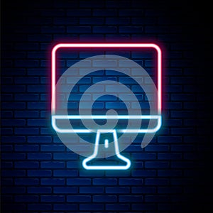 Glowing neon line Computer monitor screen icon isolated on brick wall background. Electronic device. Front view