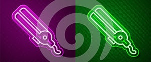 Glowing neon line Curling iron for hair icon isolated on purple and green background. Hair straightener icon. Vector