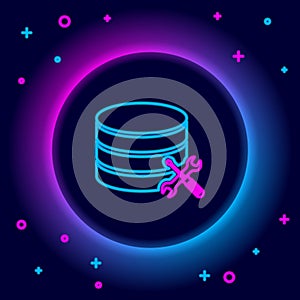 Glowing neon line Database server with screwdriver and wrench icon isolated on black background. Adjusting, service