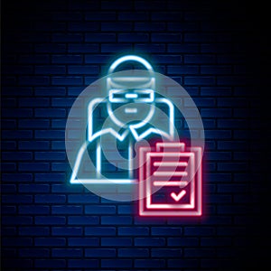 Glowing neon line Delivery man with cardboard boxes icon isolated on brick wall background. Door to door delivery by