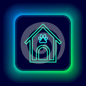 Glowing neon line Dog house and paw print pet icon isolated on black background. Dog kennel. Colorful outline concept