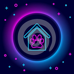 Glowing neon line Dog house and paw print pet icon isolated on black background. Dog kennel. Colorful outline concept