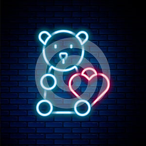 Glowing neon line Donate child toys icon isolated on brick wall background. Charity kindness, volunteer social