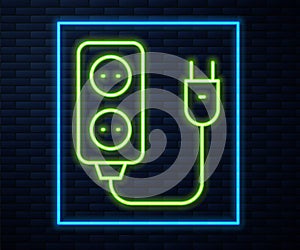 Glowing neon line Electric extension cord icon isolated on brick wall background. Power plug socket. Vector