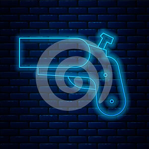 Glowing neon line Flare gun pistol signal sos icon isolated on brick wall background. Emergency fire shoot target smoke