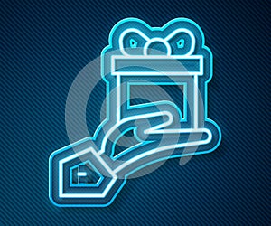 Glowing neon line Give gift icon isolated on blue background. Gift in hand. The concept of giving and receiving a gift