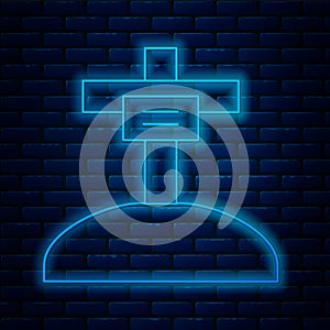 Glowing neon line Grave with cross icon isolated on brick wall background. Vector