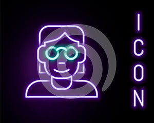 Glowing neon line Hacker or coder icon isolated on black background. Programmer developer working on code, coding