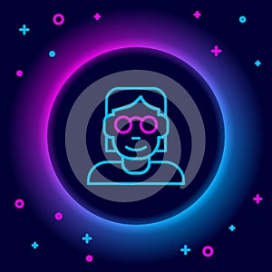 Glowing neon line Hacker or coder icon isolated on black background. Programmer developer working on code, coding